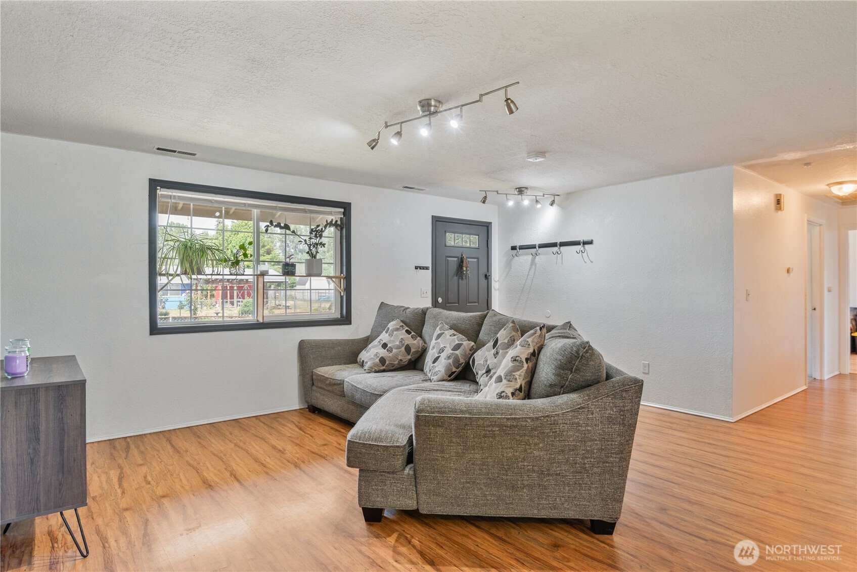 642 5th Avenue Southwest Castle Rock, WA 98611 - Photo 8 of 33 a living room with furniture and a large window