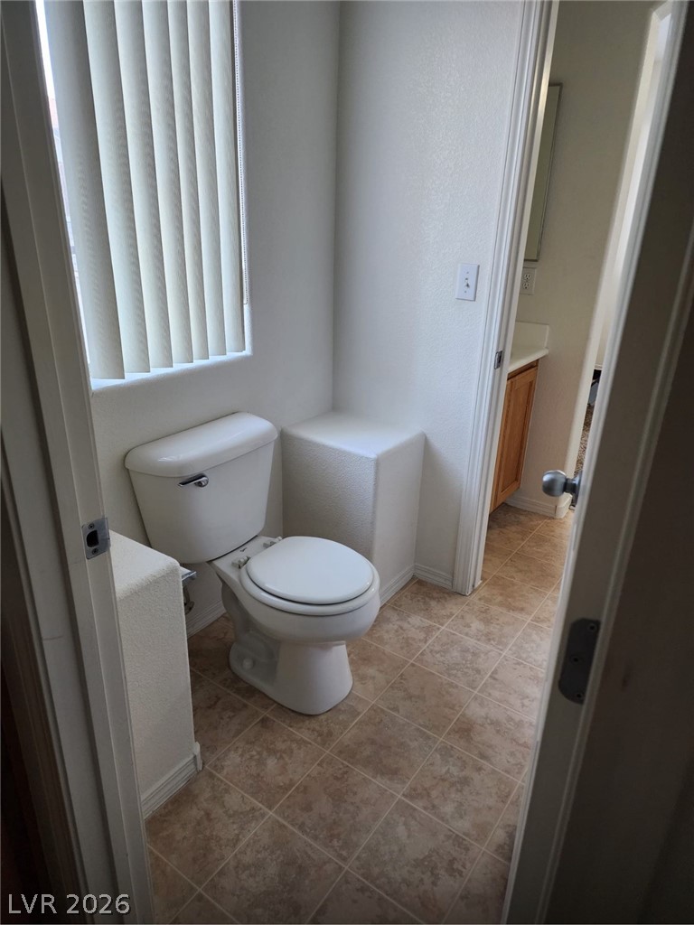 11901 Fairfax Ridge Street Las Vegas, NV 89183 - Photo 46 of 46 Half bathroom with vanity and tile patterned floors