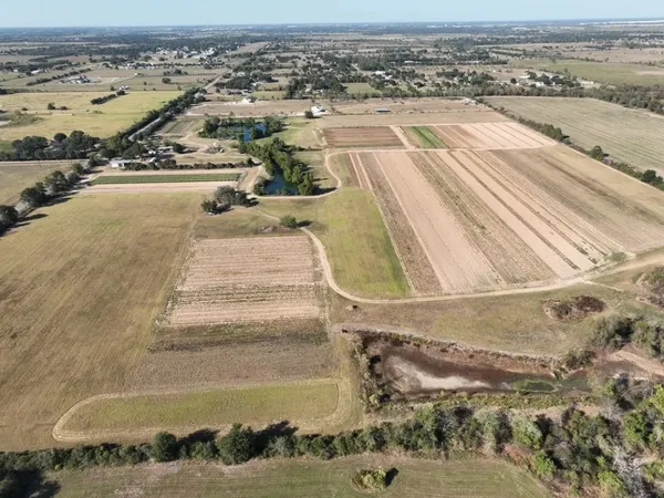 an aerial view of residential houses with outdoor space