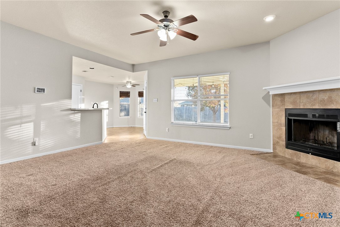 3505 Lucas Street Copperas Cove, TX 76522 - Photo 3 of 15 a view of an empty room with a window and a kitchen