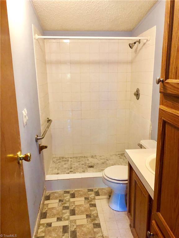 1595 Langley Loop Road Staley, NC 27355 - Photo 7 of 17 2nd bathroom