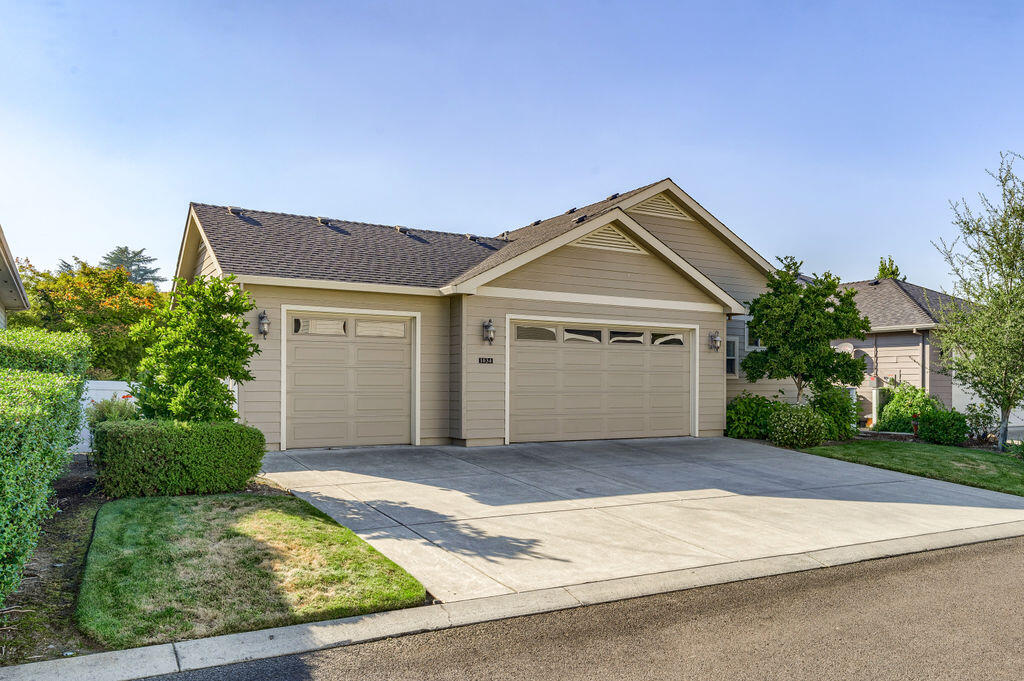 1034 Buck Point Street Central Point, OR 97502 - Photo 10 of 43 a front view of a house with garden