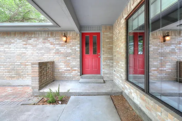 a view of front door of house with yard