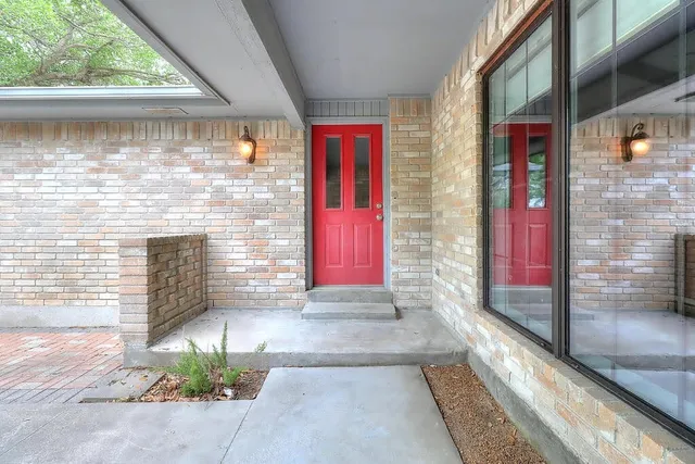 a view of front door of house with yard