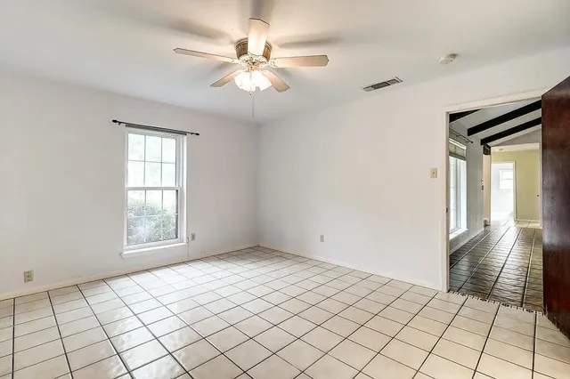 a view of an empty room and window