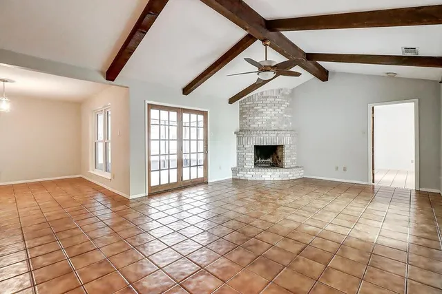 a view of an empty room with windows