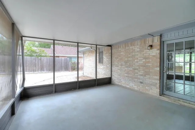 a view of an empty room with windows