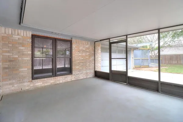 a view of an empty room with a fireplace