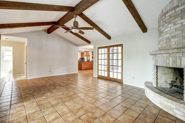 a view of an empty room with windows