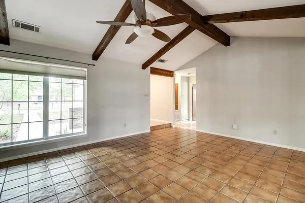 a view of an empty room and window