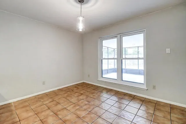 a view of an empty room and window