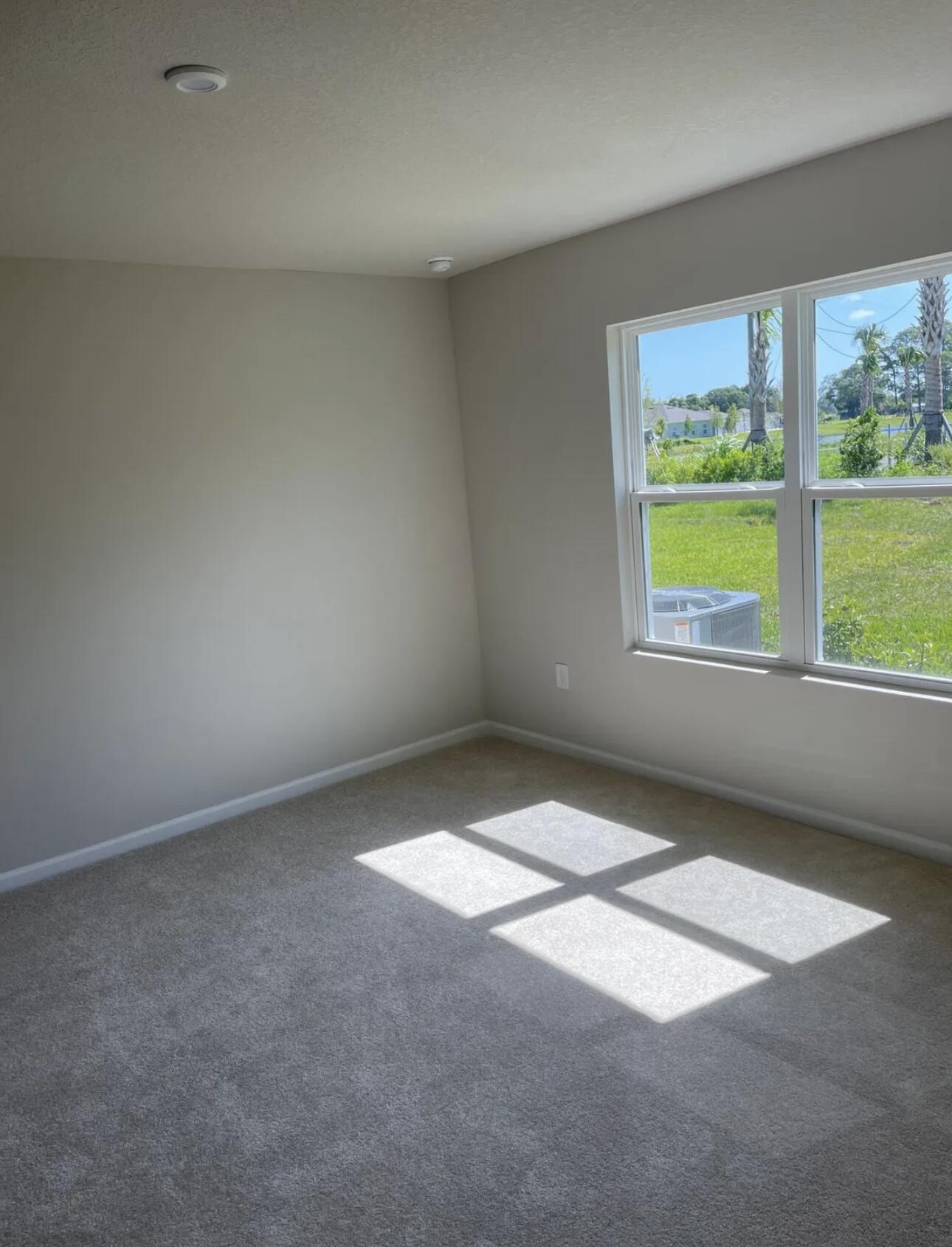 227 Raspberry Road Fort Pierce, FL 34981 - Photo 6 of 12 an empty room with a window