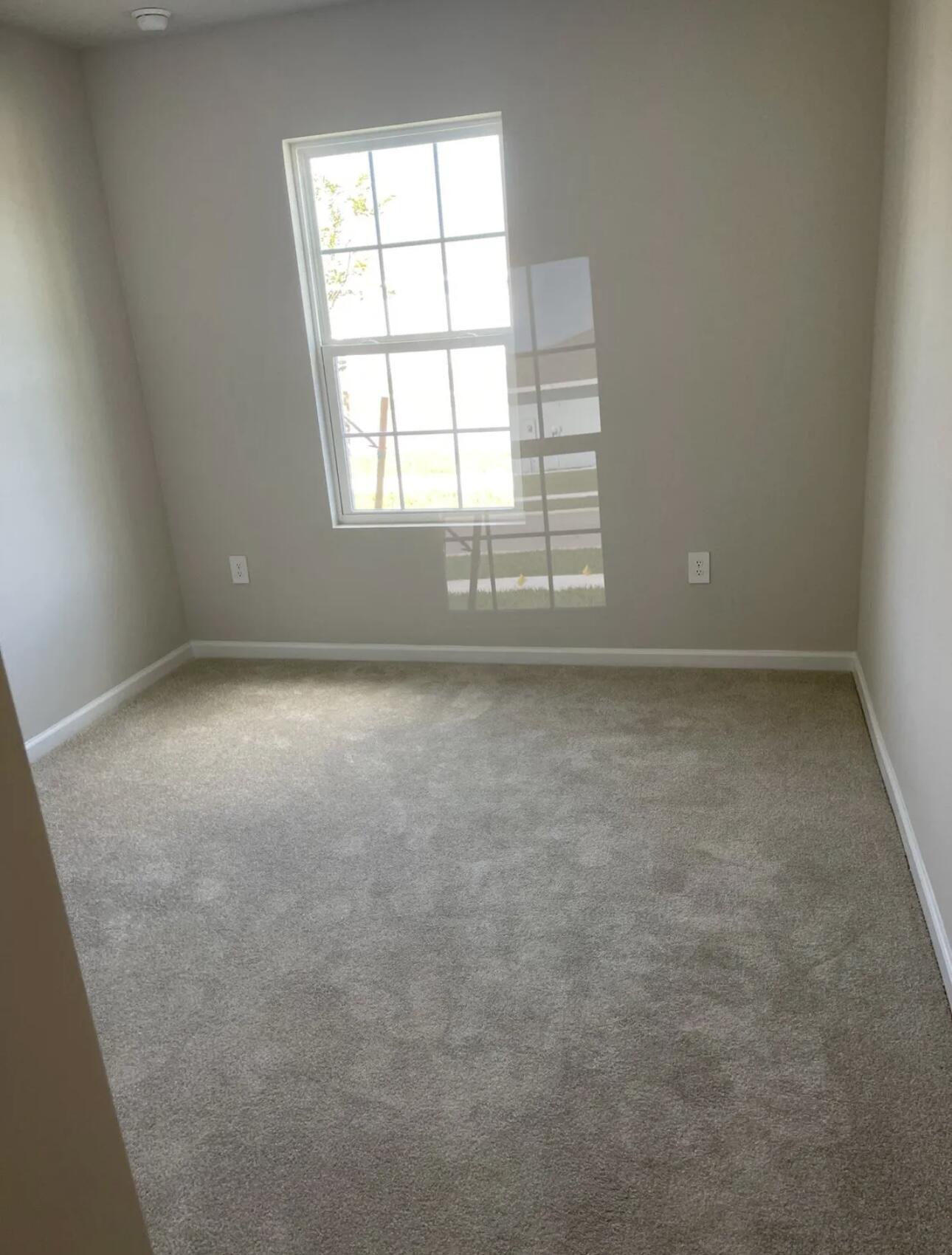 227 Raspberry Road Fort Pierce, FL 34981 - Photo 7 of 12 an empty room with a window