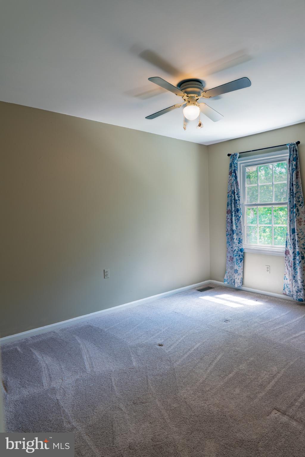 2913 Seminole Road Woodbridge, VA 22192 - Photo 14 of 34 an empty room with windows and fan