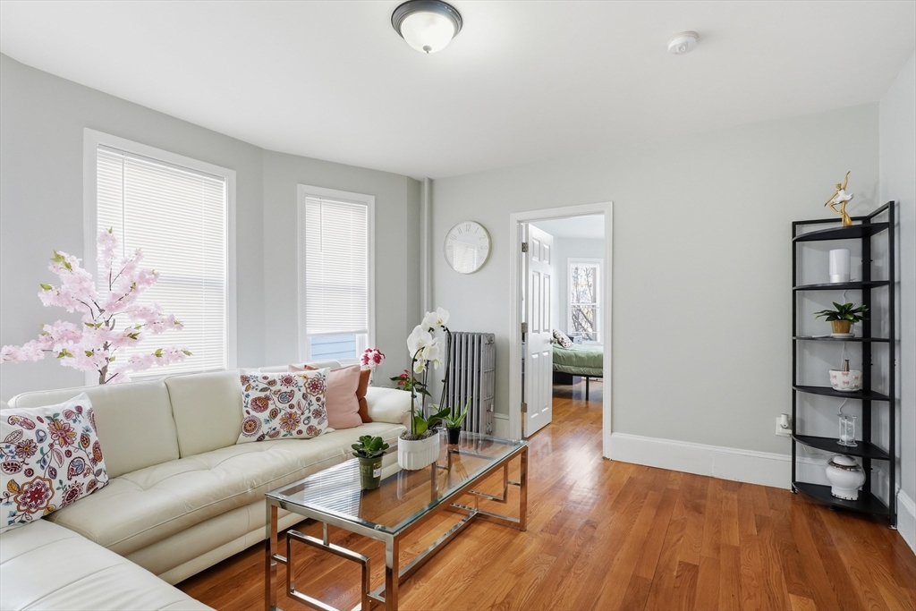 1661 North Shore Road Revere, MA 02151 - Photo 12 of 42 a living room with furniture and wooden floor