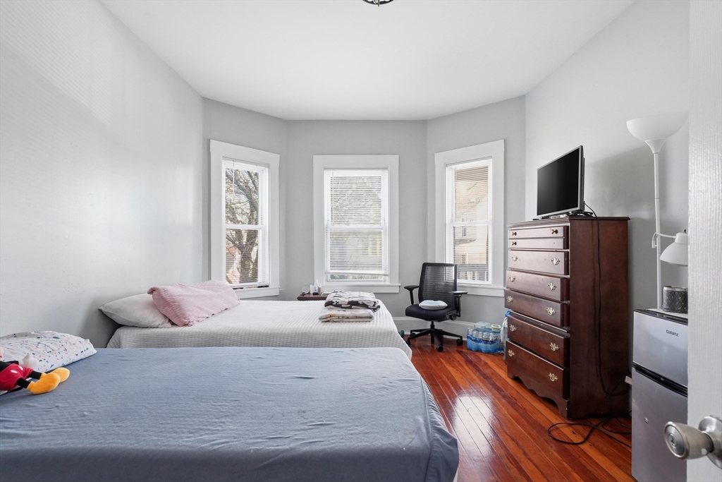 1661 North Shore Road Revere, MA 02151 - Photo 13 of 42 a bedroom with a bed and a television
