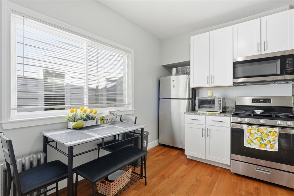 1661 North Shore Road Revere, MA 02151 - Photo 21 of 42 a kitchen with stainless steel appliances a stove a sink and a refrigerator