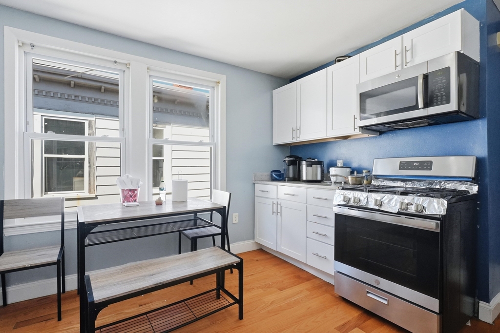 1661 North Shore Road Revere, MA 02151 - Photo 28 of 42 a kitchen with a stove and a microwave