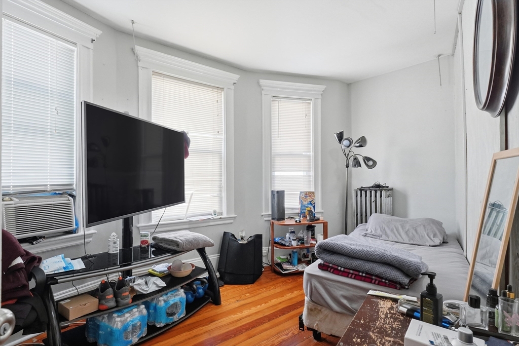 1661 North Shore Road Revere, MA 02151 - Photo 32 of 42 a living room with furniture and a flat screen tv