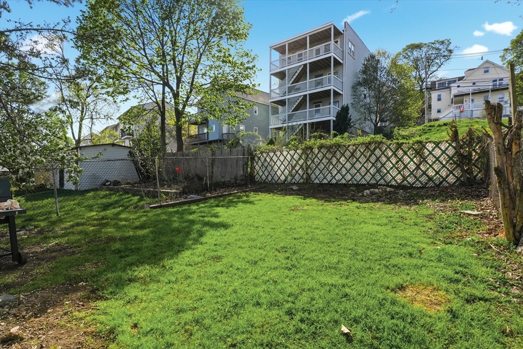 1661 North Shore Road Revere, MA 02151 - Photo 41 of 42 front view of a house with a yard