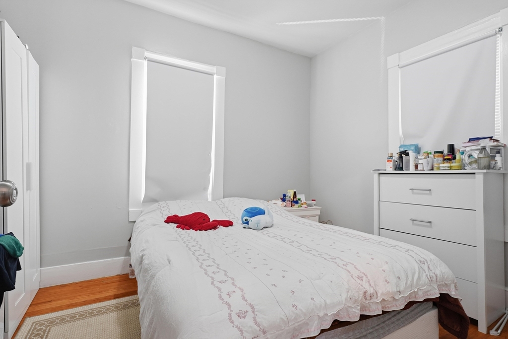 1661 North Shore Road Revere, MA 02151 - Photo 7 of 42 a bedroom with a bed and a closet