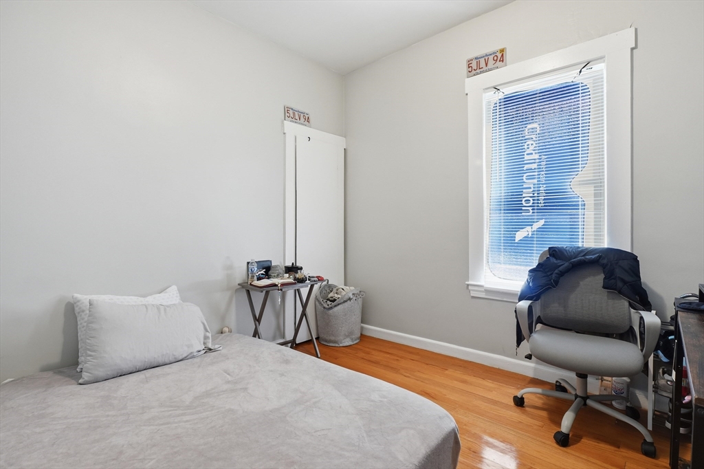 1661 North Shore Road Revere, MA 02151 - Photo 9 of 42 a bedroom with a bed and a chair