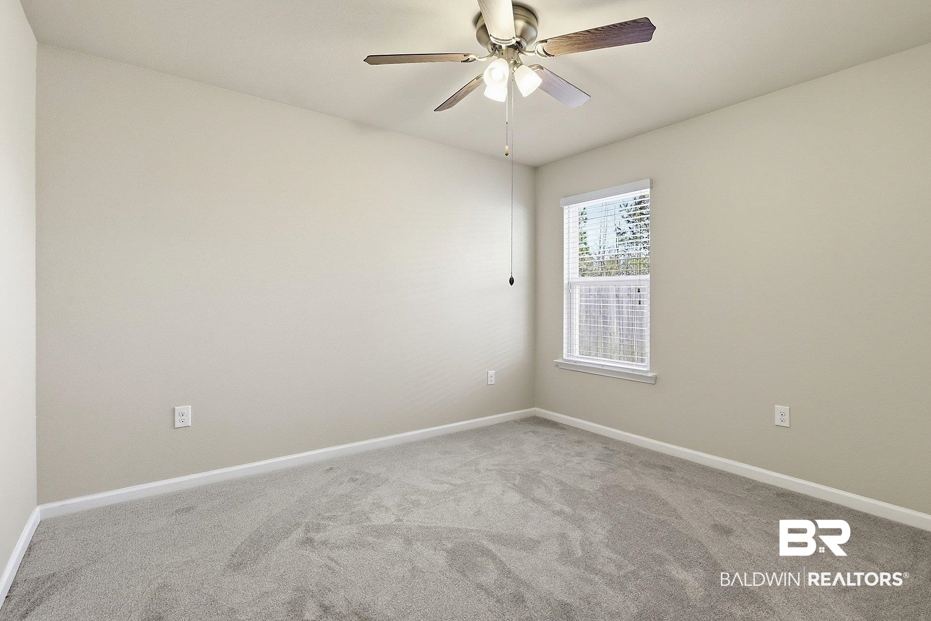 983 Summerton Drive Foley, AL 36535 - Photo 20 of 25 Carpeted spare room with baseboards and ceiling fan