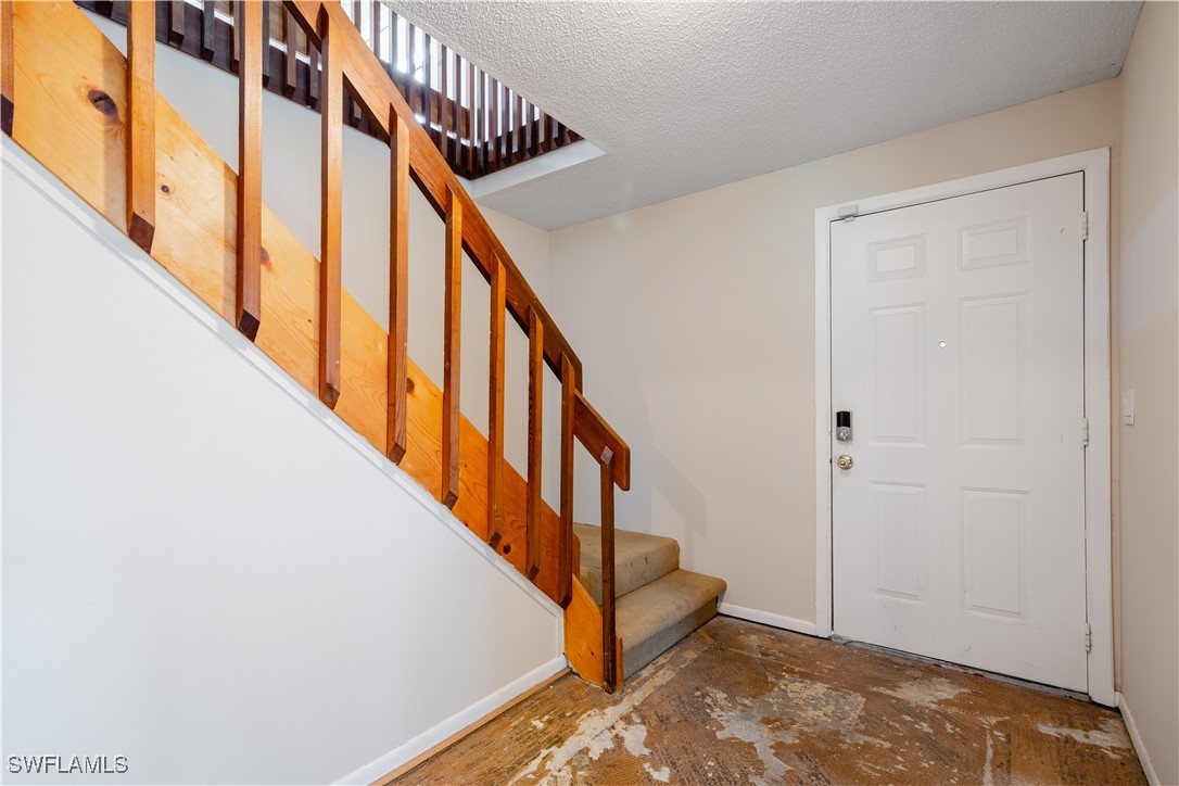 8025 Anhinga Road Fort Myers, FL 33967 - Photo 14 of 47 a view of an entryway with staircase