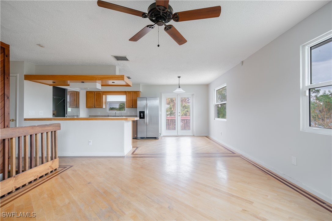 8025 Anhinga Road Fort Myers, FL 33967 - Photo 17 of 47 a view of a room with a window and wooden floor