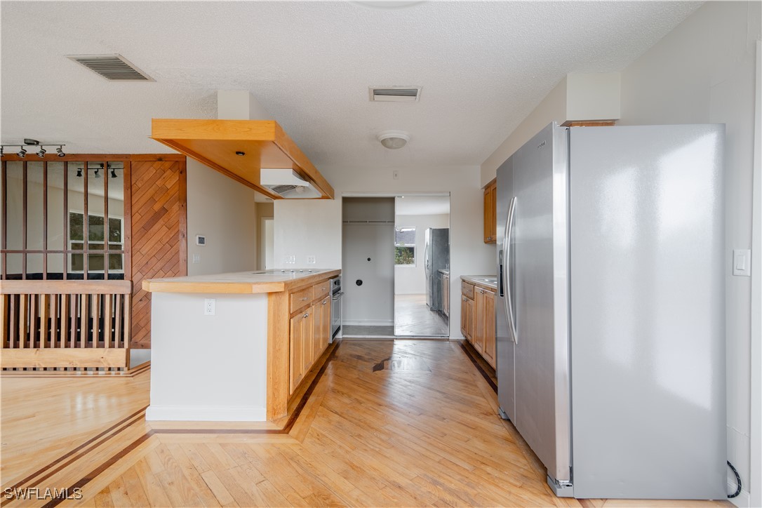 8025 Anhinga Road Fort Myers, FL 33967 - Photo 19 of 47 a hallway with cabinets
