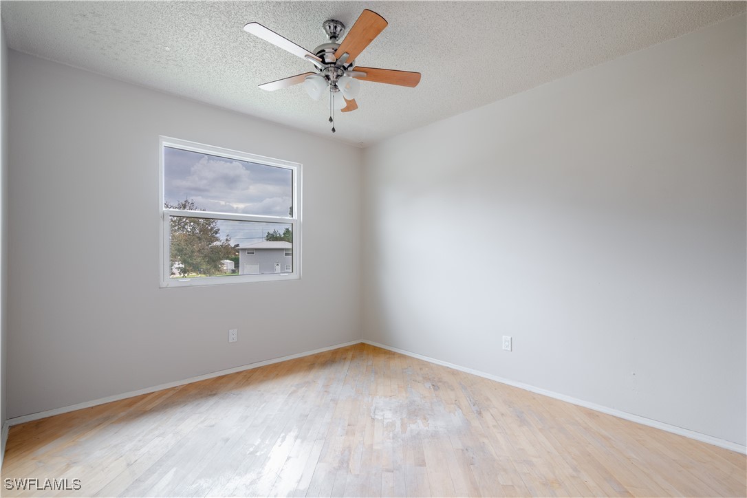 8025 Anhinga Road Fort Myers, FL 33967 - Photo 23 of 47 an empty room with a window and a fan