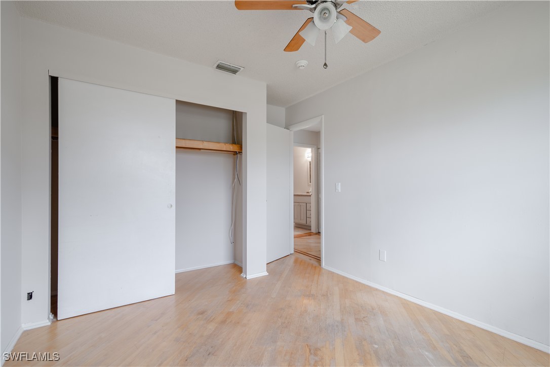 8025 Anhinga Road Fort Myers, FL 33967 - Photo 24 of 47 a view of an empty room with a ceiling fan
