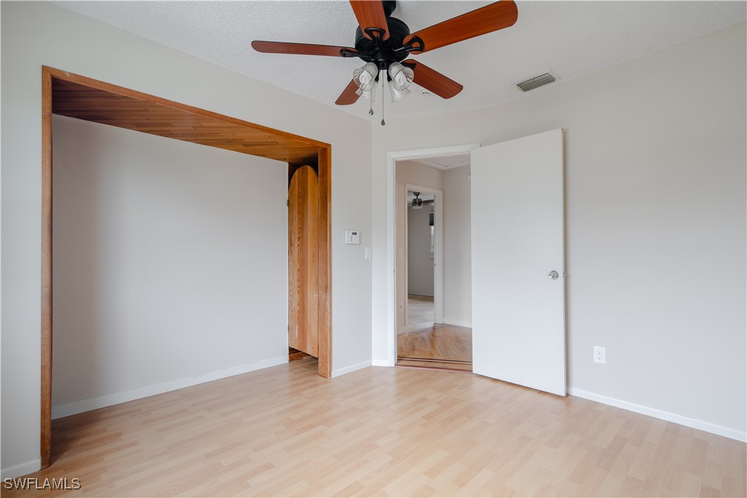 8025 Anhinga Road Fort Myers, FL 33967 - Photo 28 of 47 wooden floor in an empty room