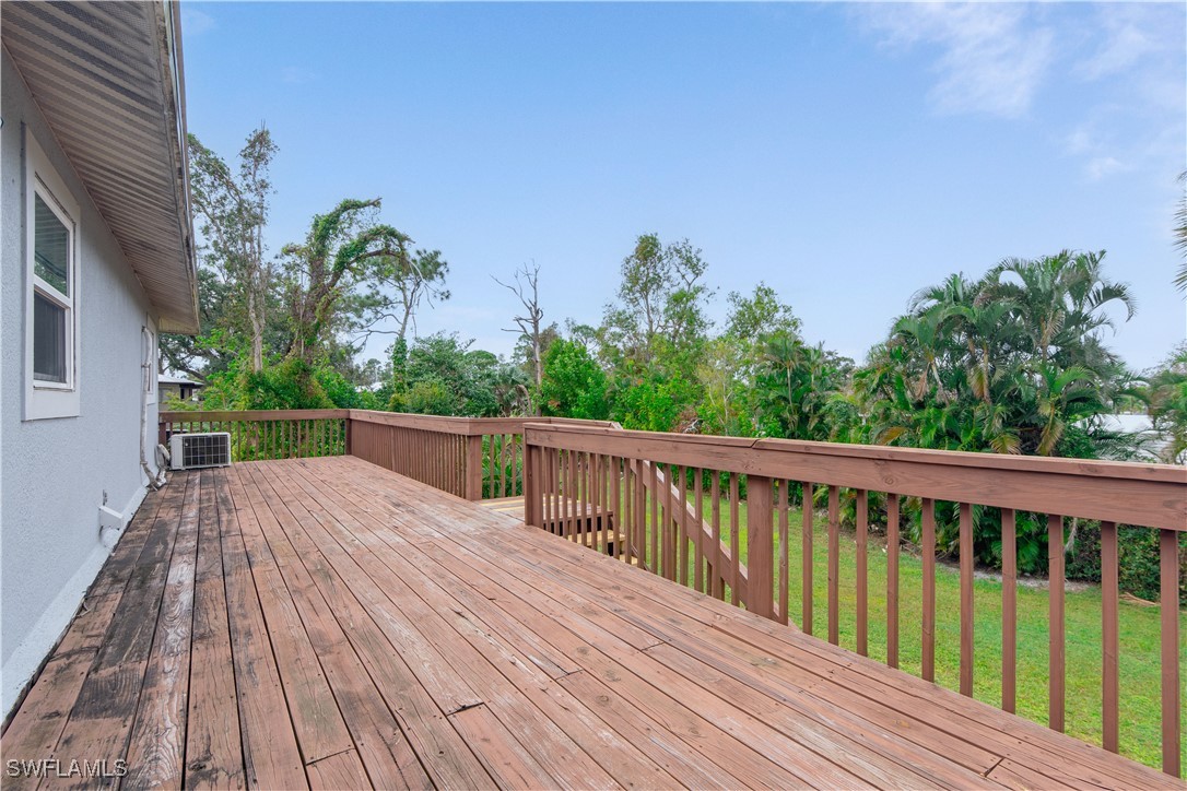 8025 Anhinga Road Fort Myers, FL 33967 - Photo 31 of 47 a view of deck with seating and trees