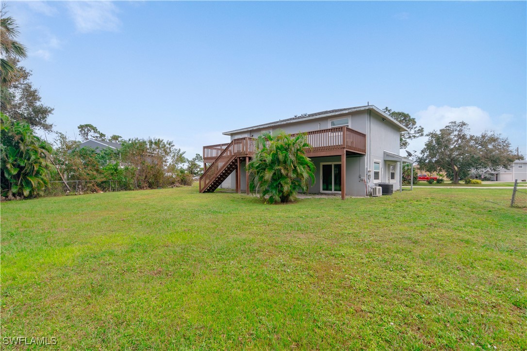 8025 Anhinga Road Fort Myers, FL 33967 - Photo 34 of 47 a front view of a house with yard and green space
