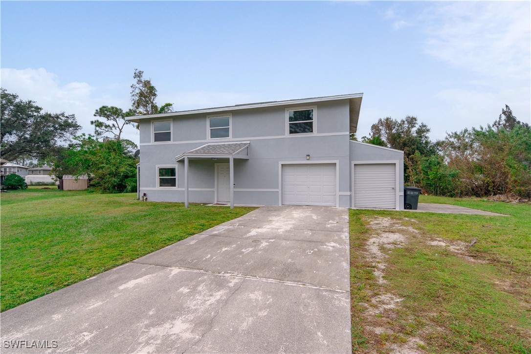 8025 Anhinga Road Fort Myers, FL 33967 - Photo 37 of 47 a front view of a house with garden