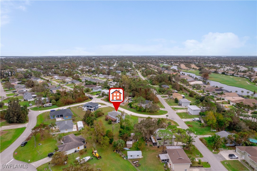 8025 Anhinga Road Fort Myers, FL 33967 - Photo 41 of 47 an aerial view of residential building and car parked