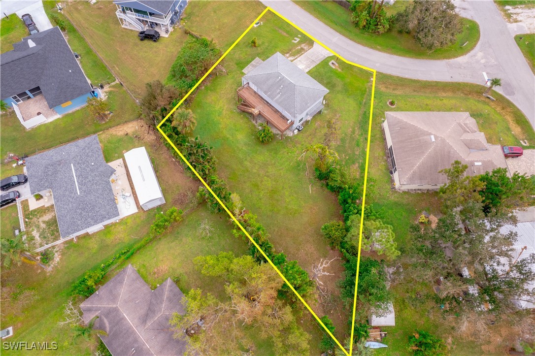 8025 Anhinga Road Fort Myers, FL 33967 - Photo 45 of 47 an aerial view of a house with a swimming pool