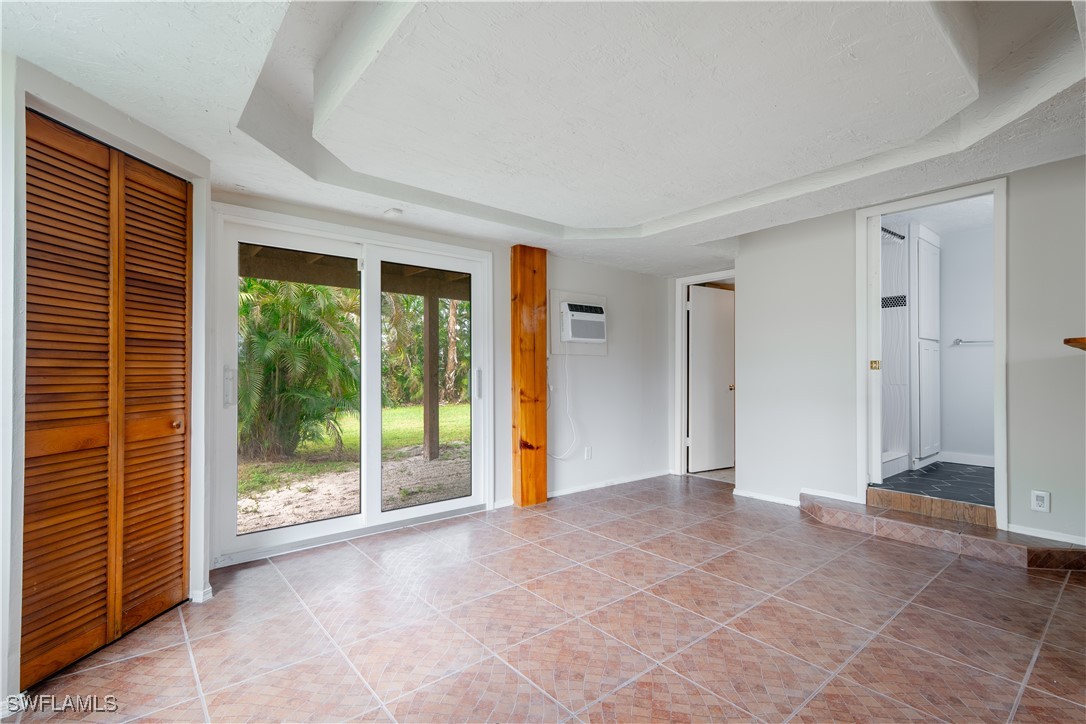 8025 Anhinga Road Fort Myers, FL 33967 - Photo 8 of 47 a view of an empty room with glass door