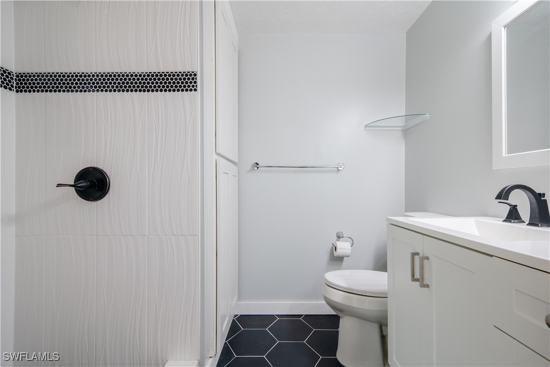 8025 Anhinga Road Fort Myers, FL 33967 - Photo 9 of 47 a bathroom with a sink toilet and shower