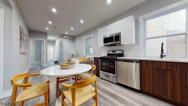 a kitchen with a sink cabinets and window