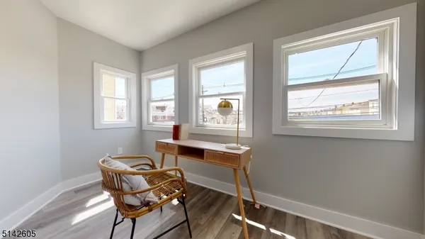 a dining room with furniture and windows