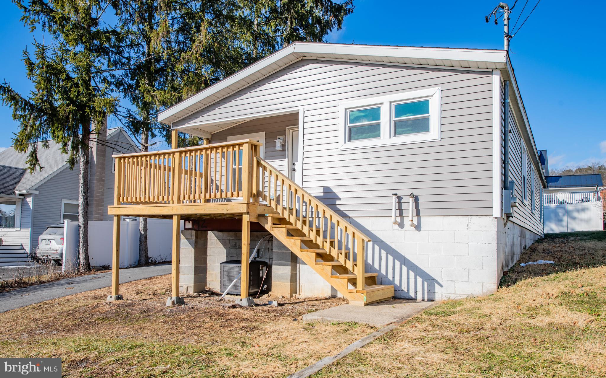 a view of a house with wooden stairs