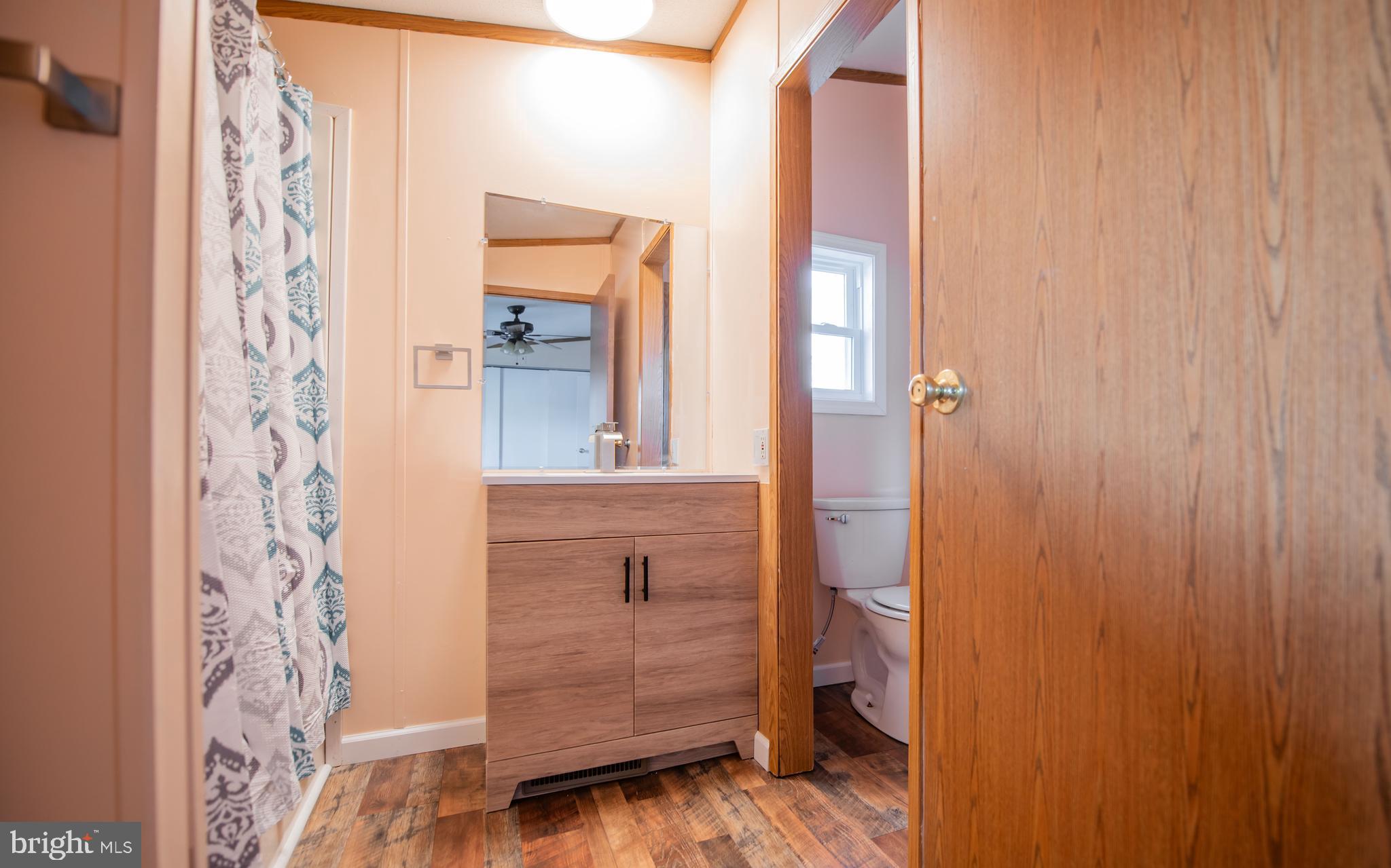 937 Center Street Lock Haven, PA 17745 - Photo 12 of 20 a bathroom with a shower curtain and a sink