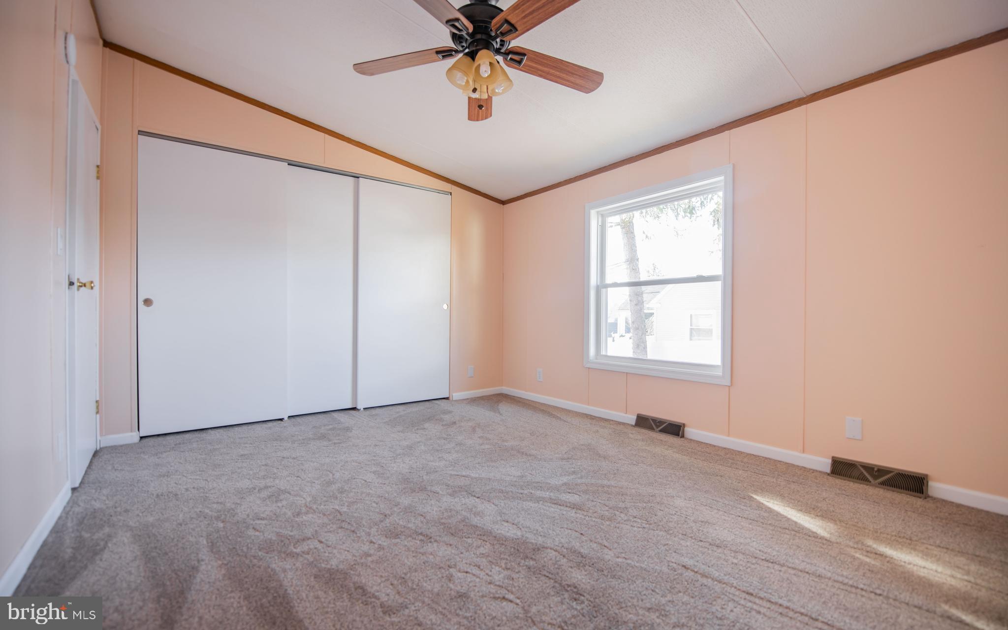 937 Center Street Lock Haven, PA 17745 - Photo 13 of 20 an empty room with windows and fan