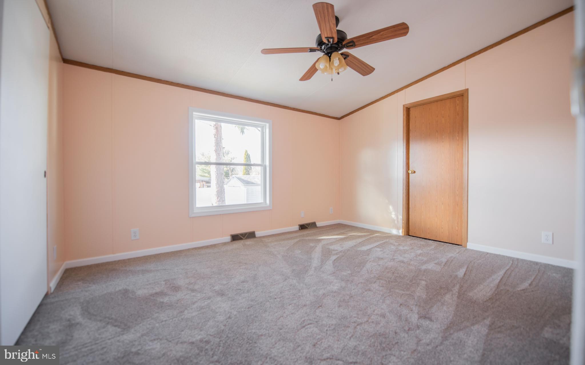 937 Center Street Lock Haven, PA 17745 - Photo 14 of 20 an empty room with windows and fan