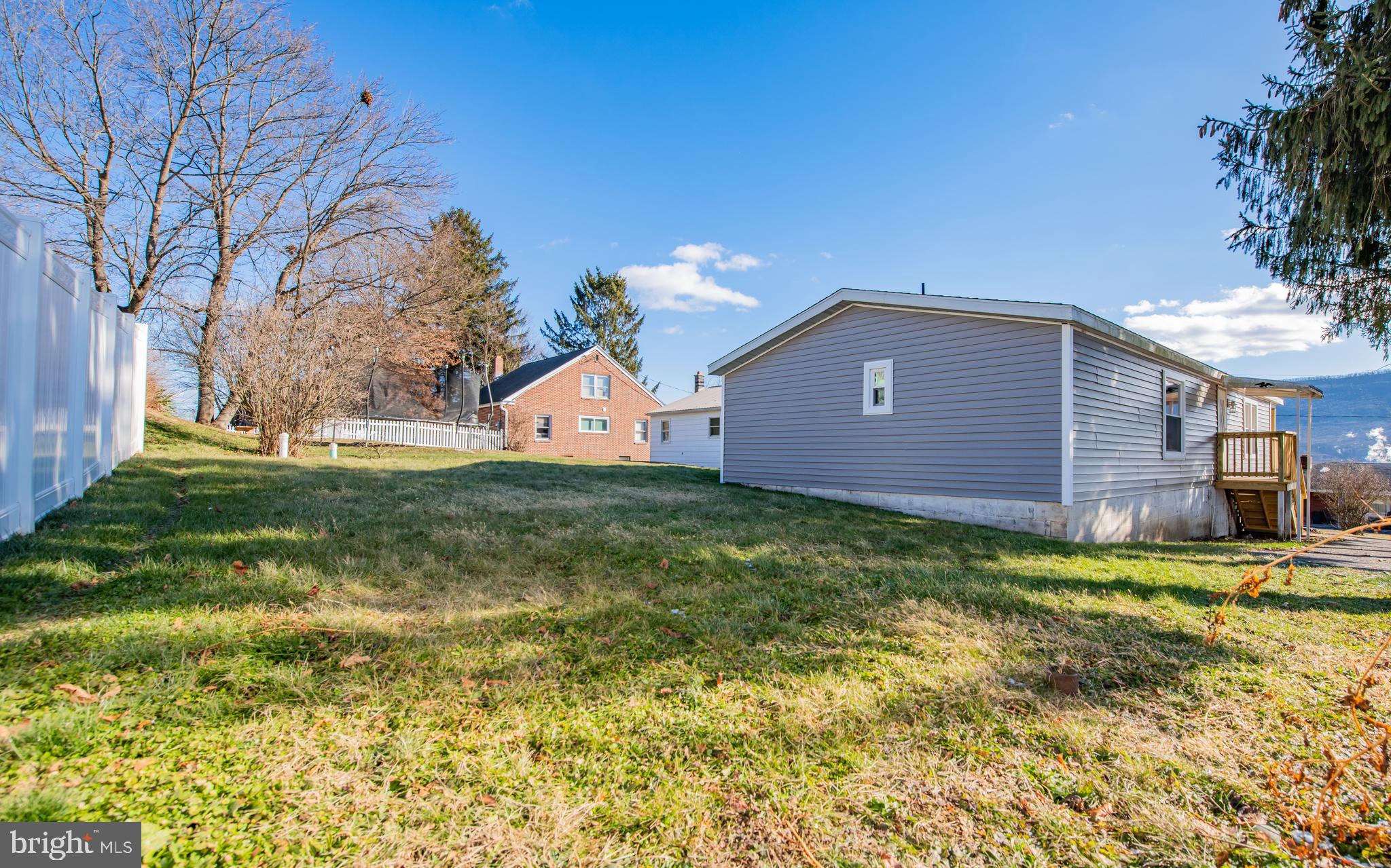 937 Center Street Lock Haven, PA 17745 - Photo 19 of 20 a view of a house with a yard