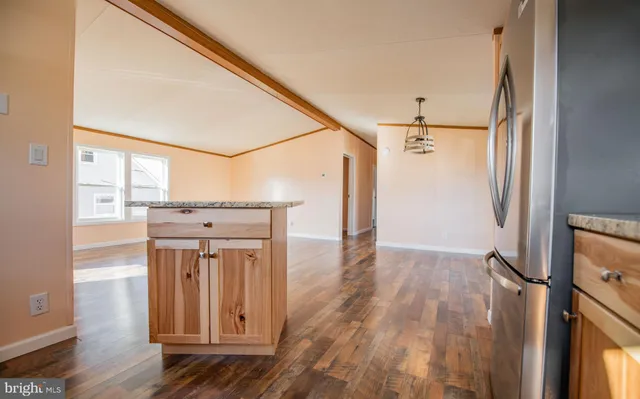 a view of hallway with wooden floor