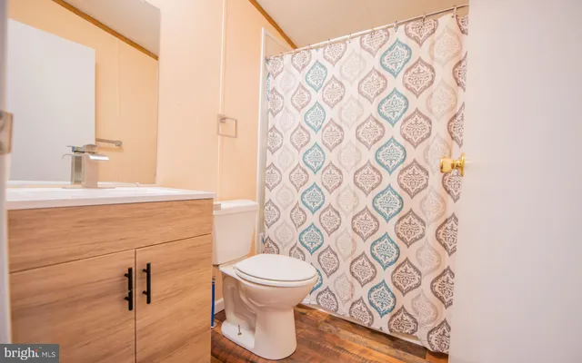 a bathroom with a toilet and a sink