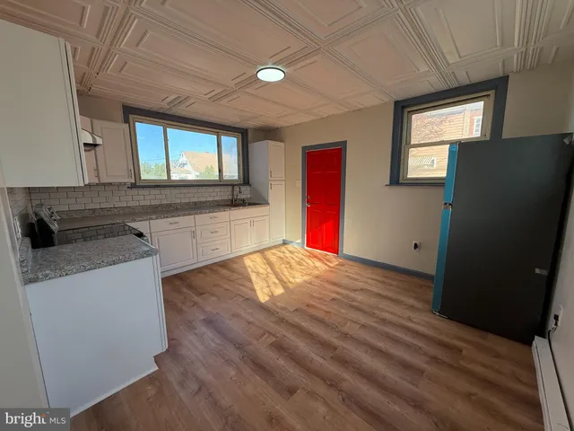 a view of kitchen and wooden floor